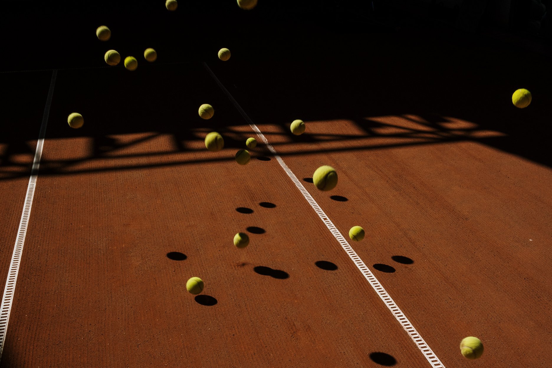 Green Tennis Ball on the Tennis Court